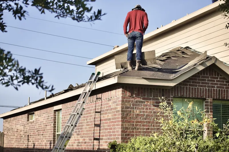 Professional roofer working on a residential roof in Red Lion Inn Estates